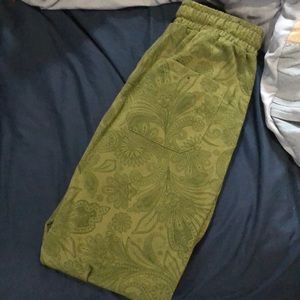 Dark green paisley-designed joggers